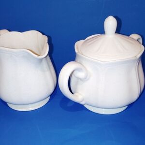 The Vintage Federalist Ironstone Creamer Sugar Set is a charming and collectible